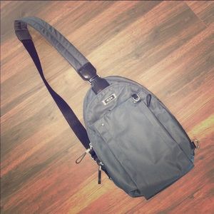 Tumi crossbody backpack. No flaws.